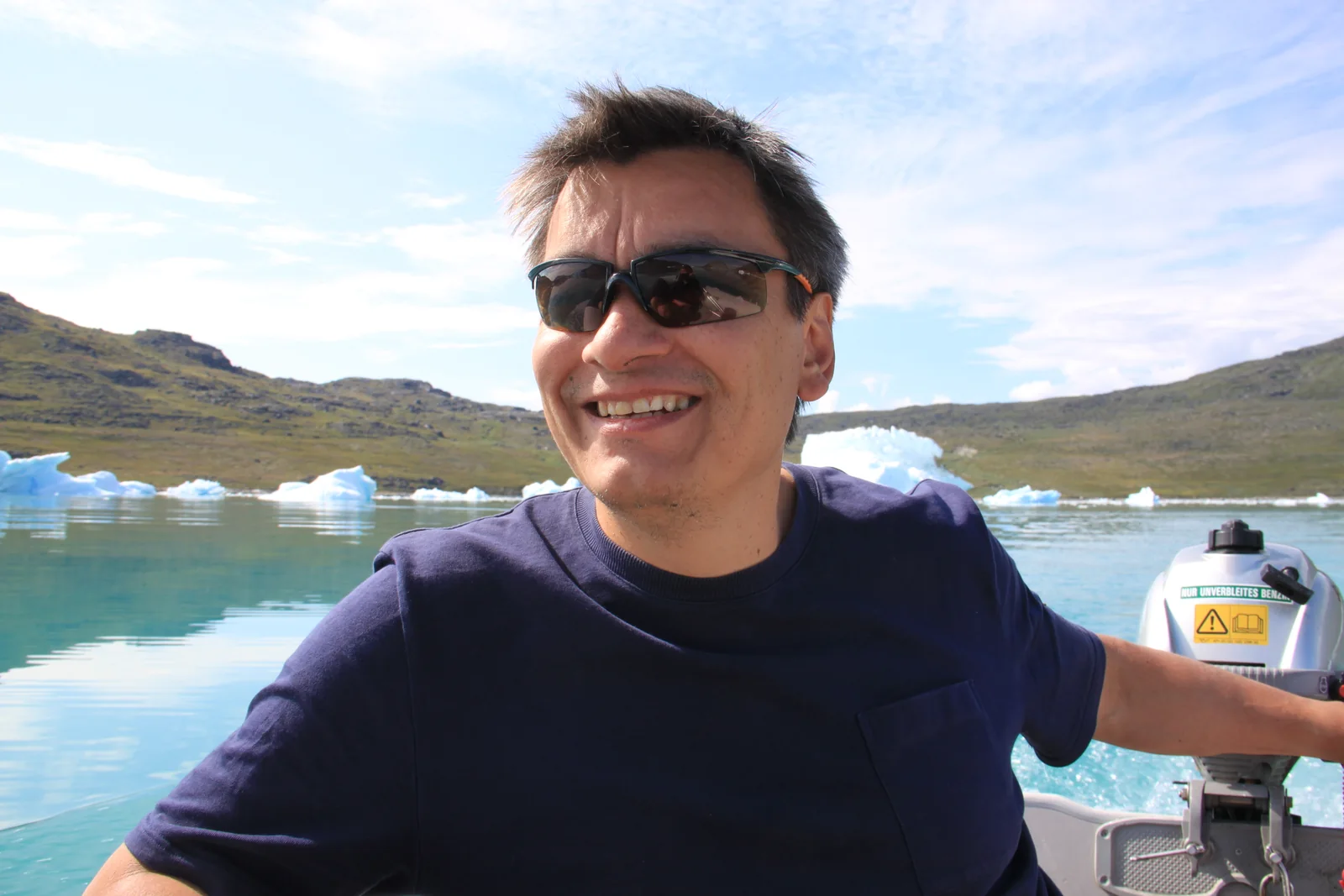 Poul Bloch Jensen by boat among icebergs in Greenland